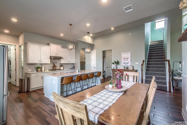 dining room featuring dark hardwood / wood-style flooring and sink