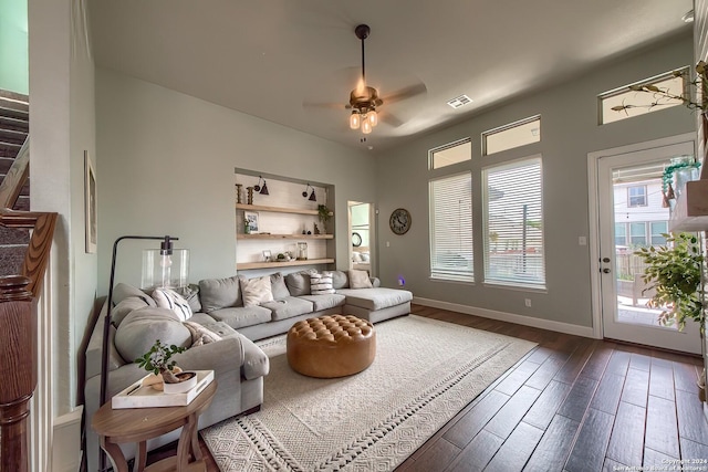 living room with ceiling fan and hardwood / wood-style flooring