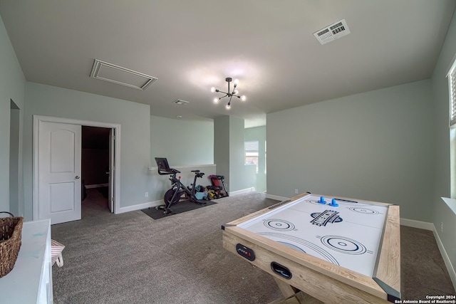 playroom with carpet and an inviting chandelier