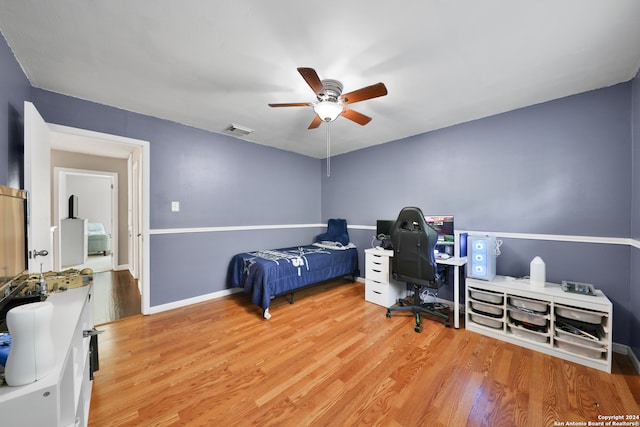 office space with ceiling fan and light hardwood / wood-style floors