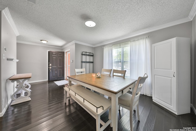 dining room with dark hardwood / wood-style flooring, a textured ceiling, and crown molding