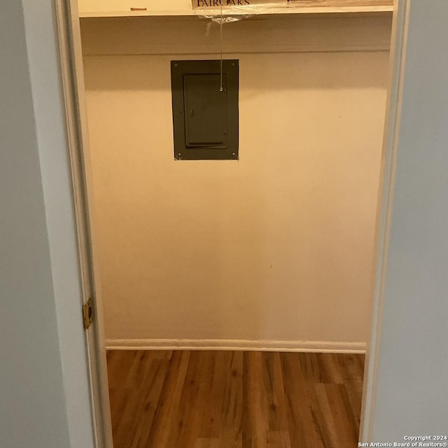 walk in closet featuring wood-type flooring and electric panel