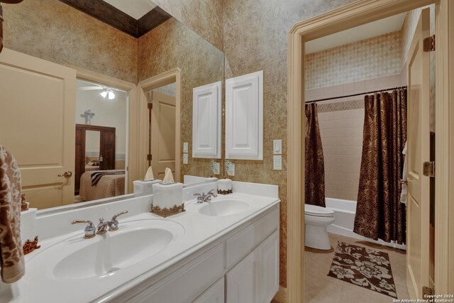 carpeted bedroom featuring ensuite bath, ceiling fan, and lofted ceiling