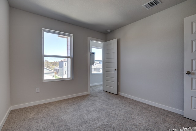 empty room with light carpet