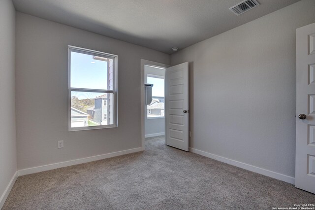 14518 Emerio Dr, San Antonio, TX 78253 - unfurnished room with carpet floors, visible vents, and baseboards