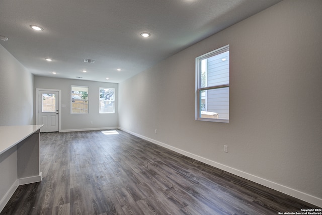 empty room with dark hardwood / wood-style floors