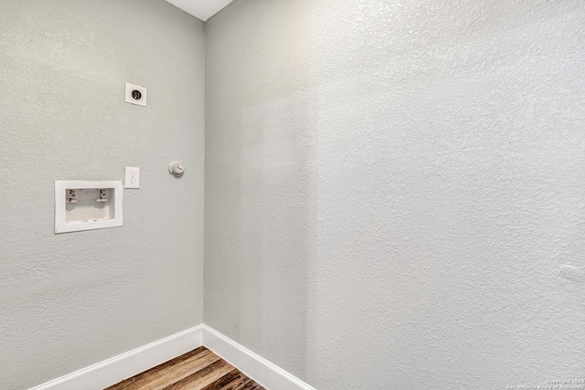 clothes washing area featuring electric dryer hookup, hookup for a washing machine, and wood-type flooring