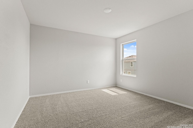 empty room featuring carpet floors