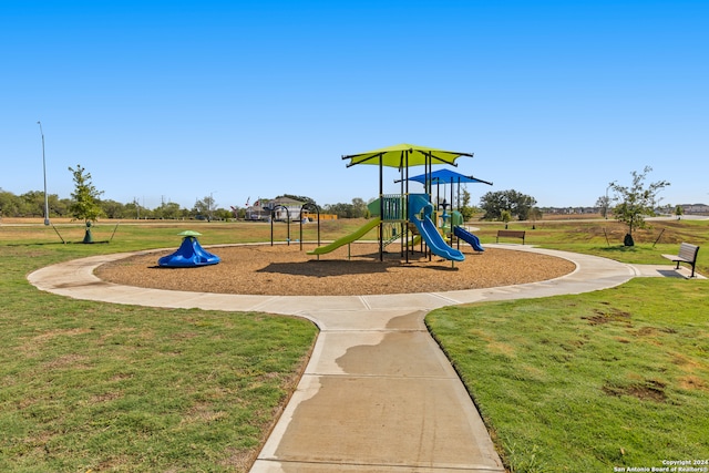 view of playground featuring a lawn