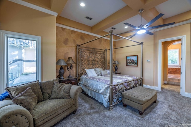 carpeted bedroom with beamed ceiling