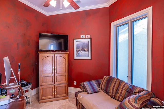 sitting room with ornamental molding and ceiling fan