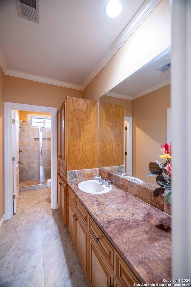 bathroom featuring walk in shower, vanity, crown molding, and toilet