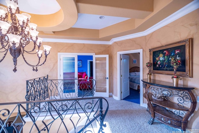 bedroom featuring carpet floors, ornamental molding, and a chandelier