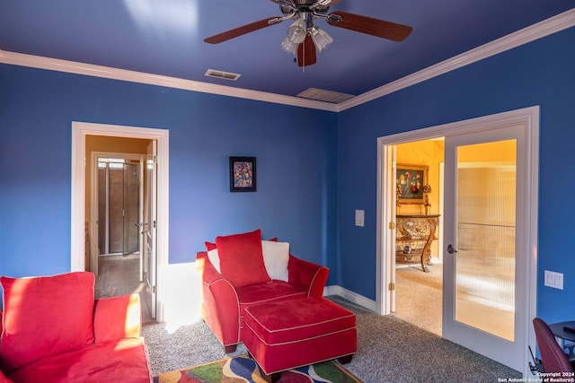 sitting room featuring ornamental molding, carpet flooring, ceiling fan, and french doors