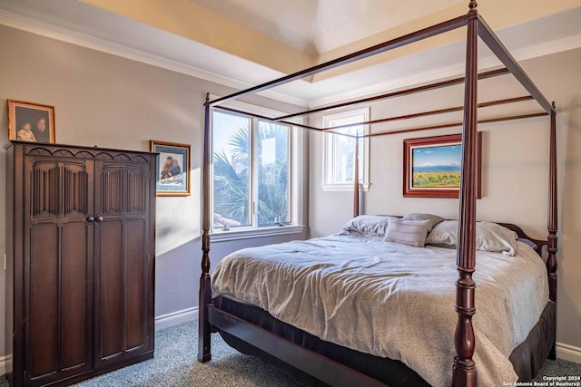 bedroom with crown molding and carpet