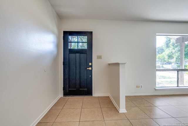 tiled foyer featuring a wealth of natural light