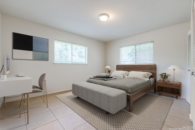 bedroom with light tile patterned flooring