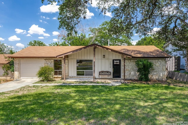 ranch-style house with a front yard and a garage