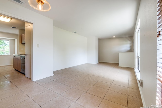 unfurnished room with light tile patterned floors