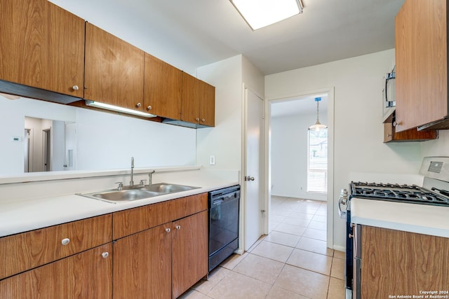 kitchen with hanging light fixtures, dishwasher, stainless steel range with gas cooktop, light tile patterned floors, and sink