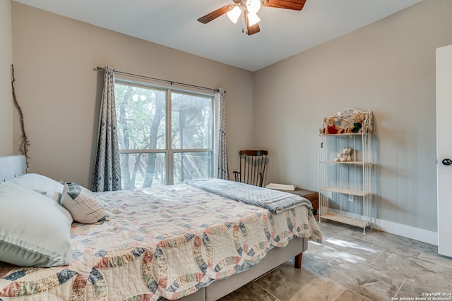 tiled bedroom with ceiling fan