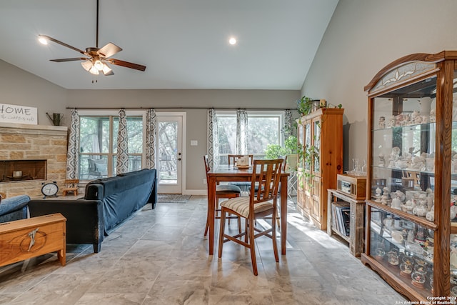 dining area featuring light tile patterned floors, a healthy amount of sunlight, ceiling fan, and high vaulted ceiling