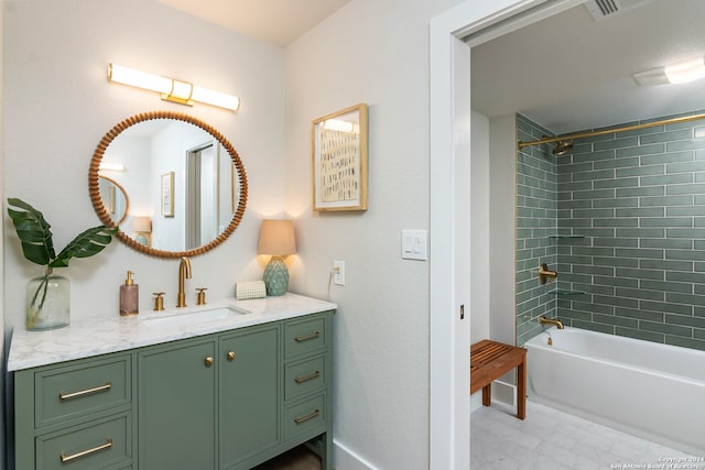 bathroom with vanity, tiled shower / bath combo, and tile patterned floors