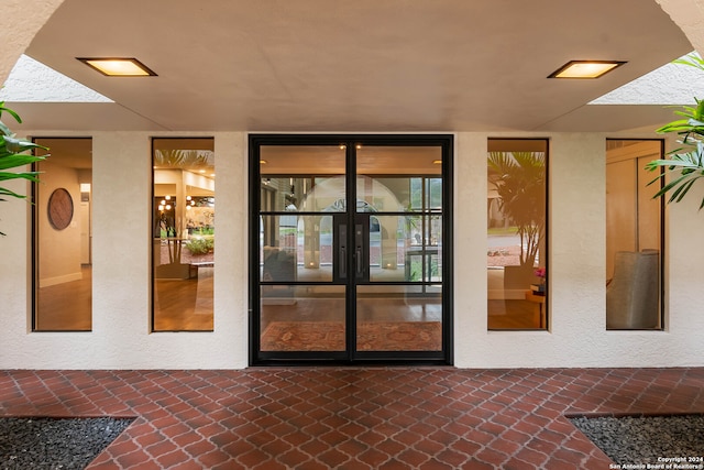 property entrance featuring french doors