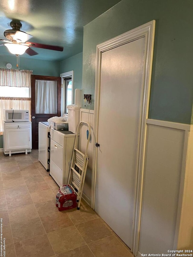 clothes washing area with ceiling fan and washing machine and clothes dryer