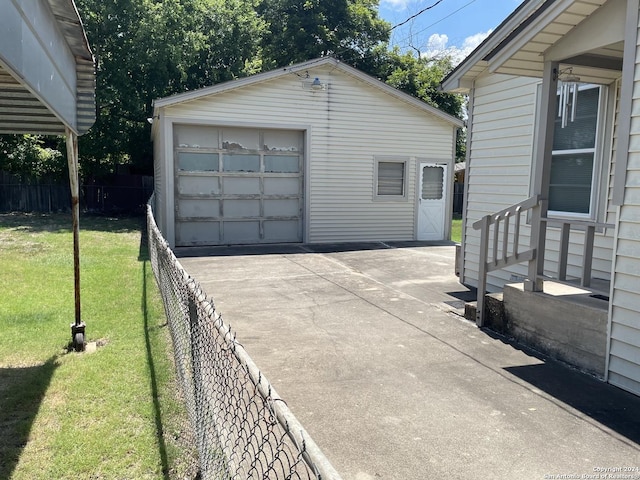 garage featuring a yard