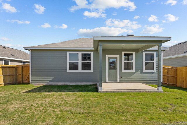2540 Solon Ln, Seguin, TX 78155 - rear view of property with a lawn and a fenced backyard