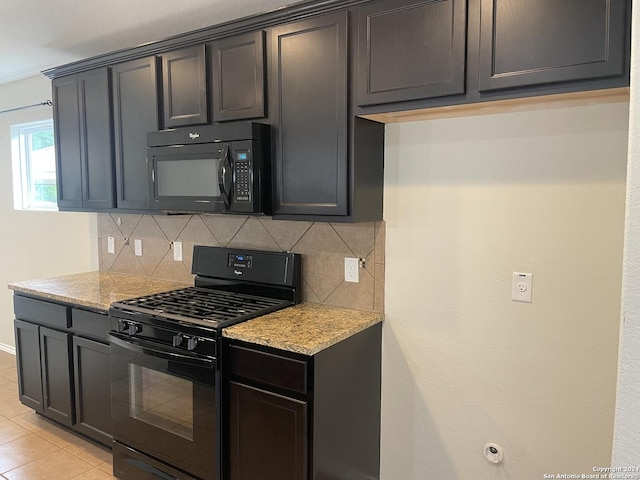 kitchen with decorative backsplash, light tile patterned floors, light stone countertops, and black appliances