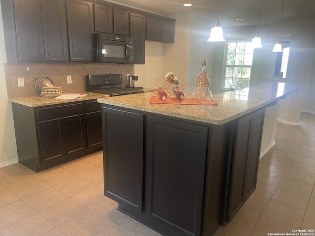 kitchen with black appliances, light tile patterned flooring, a center island with sink, and pendant lighting