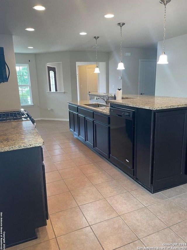 kitchen with dishwasher, sink, an island with sink, pendant lighting, and light tile patterned flooring