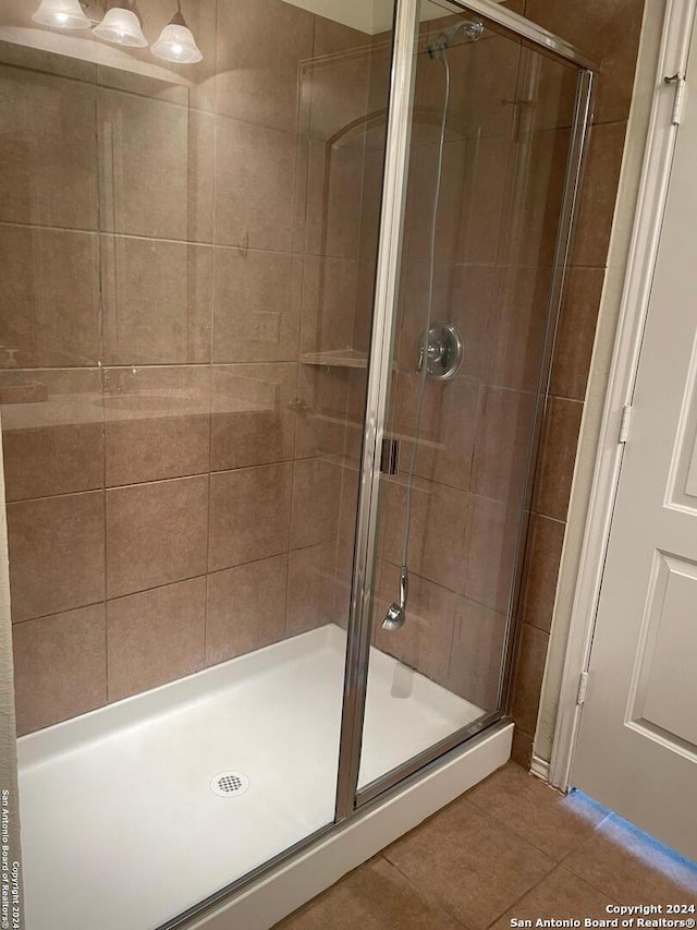 bathroom featuring tile patterned floors and walk in shower