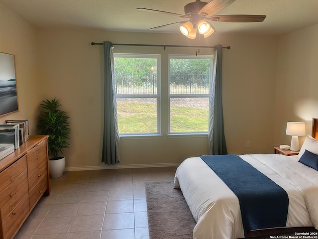 bedroom featuring ceiling fan and light tile patterned floors