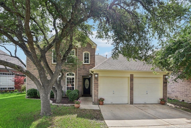 view of front of home featuring a garage and a front lawn