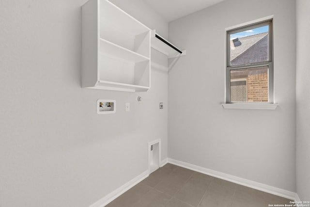 laundry area with electric dryer hookup, hookup for a washing machine, and hookup for a gas dryer