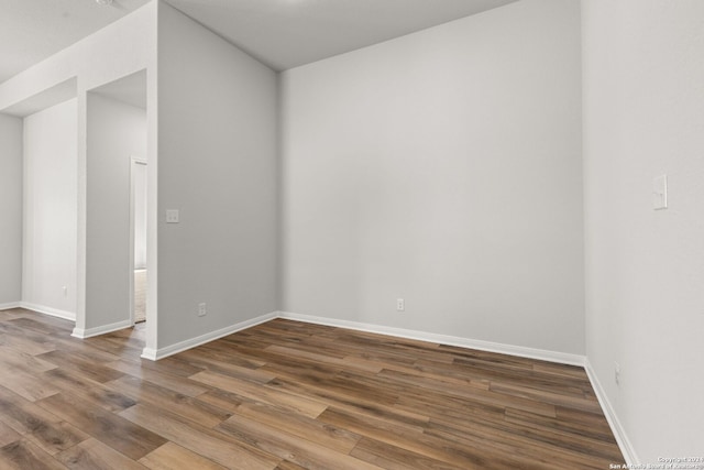 unfurnished room featuring hardwood / wood-style flooring