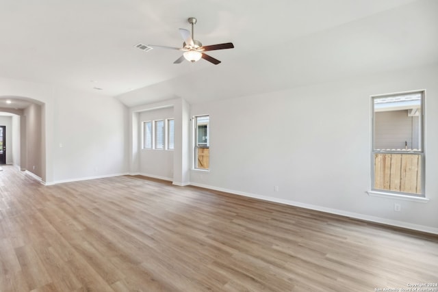 unfurnished living room featuring ceiling fan, lofted ceiling, and light hardwood / wood-style flooring