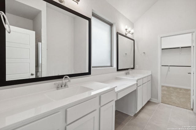 bathroom featuring vaulted ceiling, vanity, and tile patterned floors