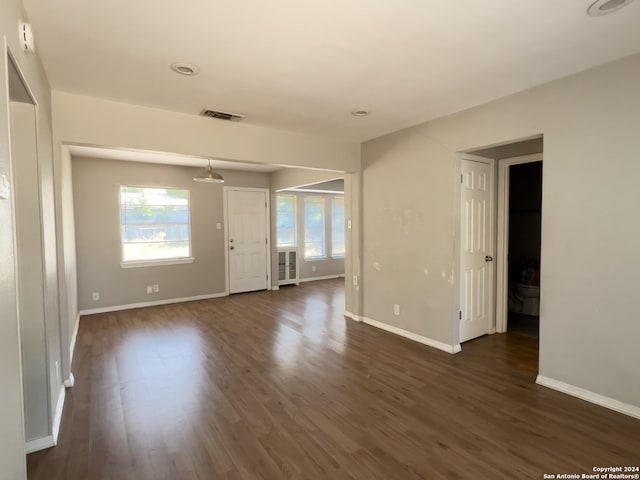 spare room with dark hardwood / wood-style flooring