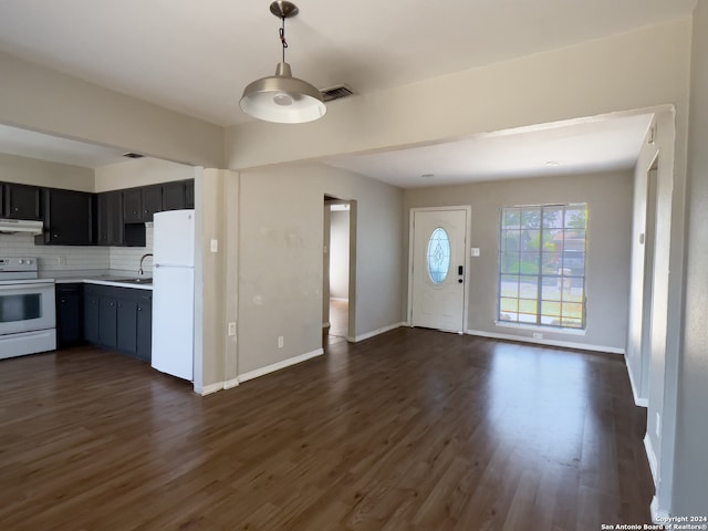 kitchen featuring extractor fan, tasteful backsplash, dark hardwood / wood-style floors, and white appliances