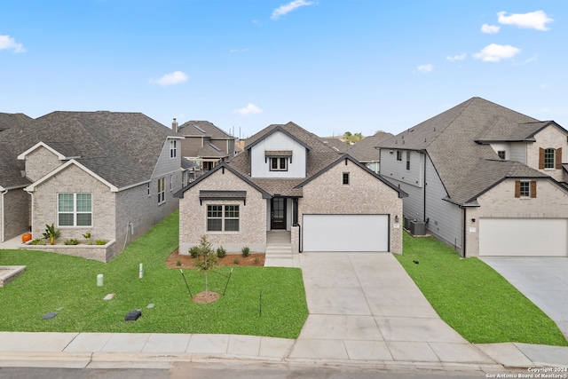 view of front facade with a front yard and a garage