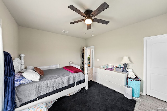 bedroom featuring light wood-type flooring and ceiling fan