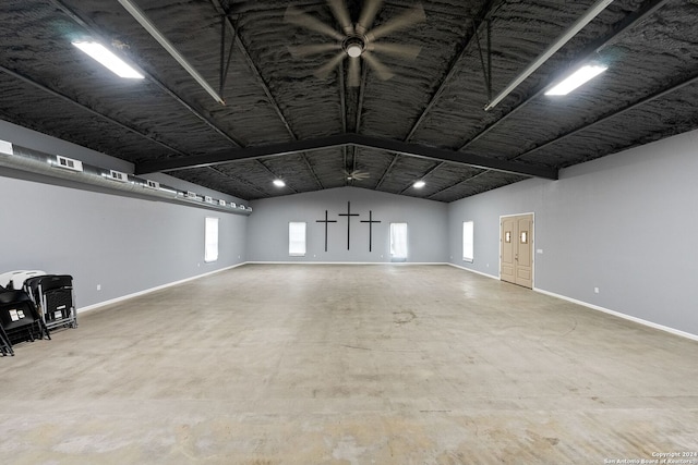 unfurnished room featuring lofted ceiling and plenty of natural light