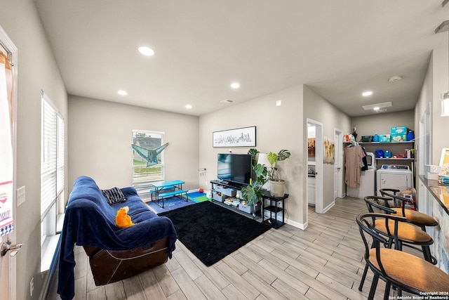 living room with washing machine and clothes dryer