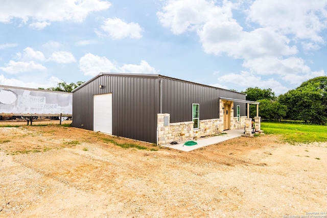 view of outdoor structure with a garage