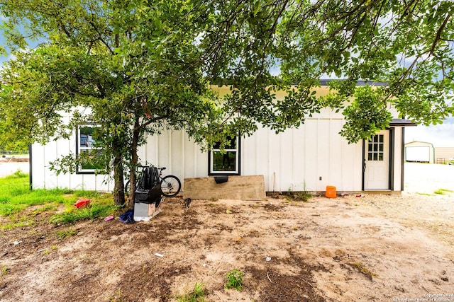 view of home's exterior featuring an outbuilding