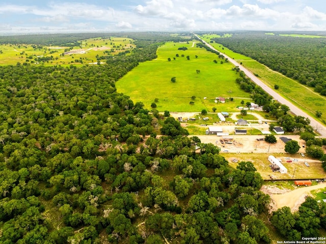 birds eye view of property with a rural view